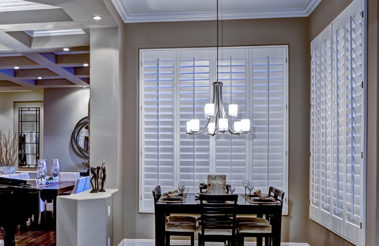 White plantation shutters in dining room